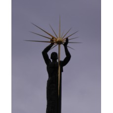 The bronze man and the sun monument